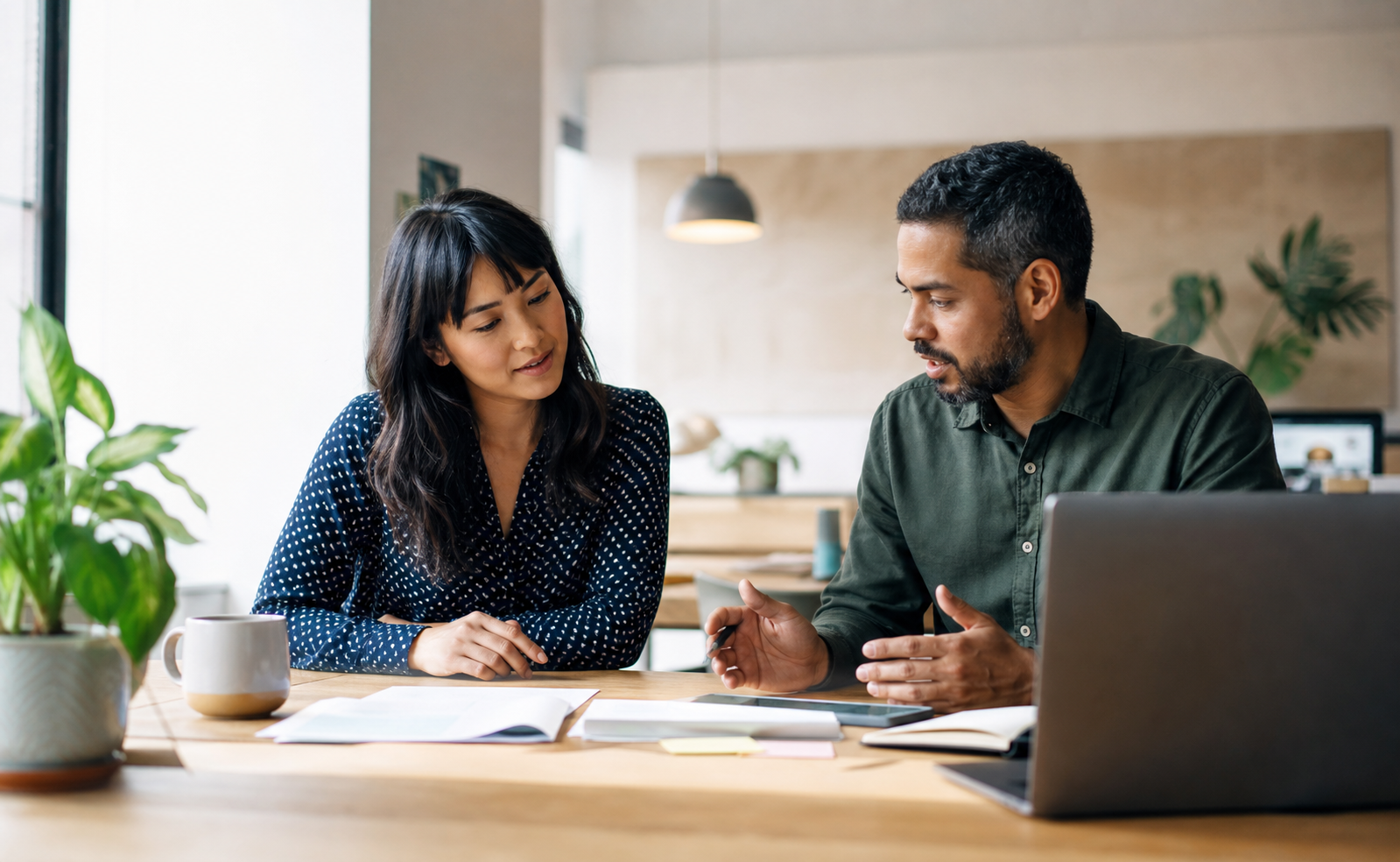 Two small-business professionals reviewing a digital plan together